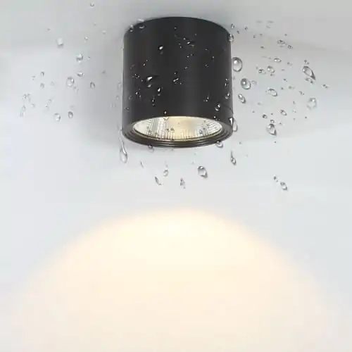 Waterproof black LED downlight with water droplets, ideal for outdoor commercial lighting.